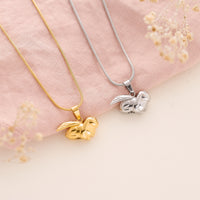 Rabbit Urn Necklace for Pet Ashes in silver and gold.