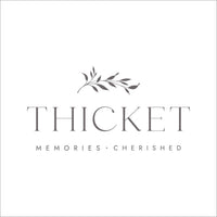 Thicket Memorials Logo. Dark grey text on a white background reads: "Thicket - Memories Cherished". Personalised Urns, Cremation Urns, Urn for mum, urn for dad, urn for husband, urn for wife.