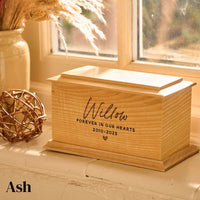 An ash urn for pet ashes. It is a personalised pet urn with the name "Willow" on it. The urn is made of ash.