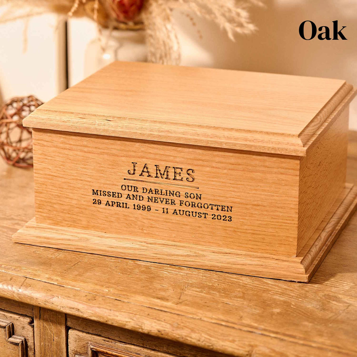 An oak urn for son's ashes. 